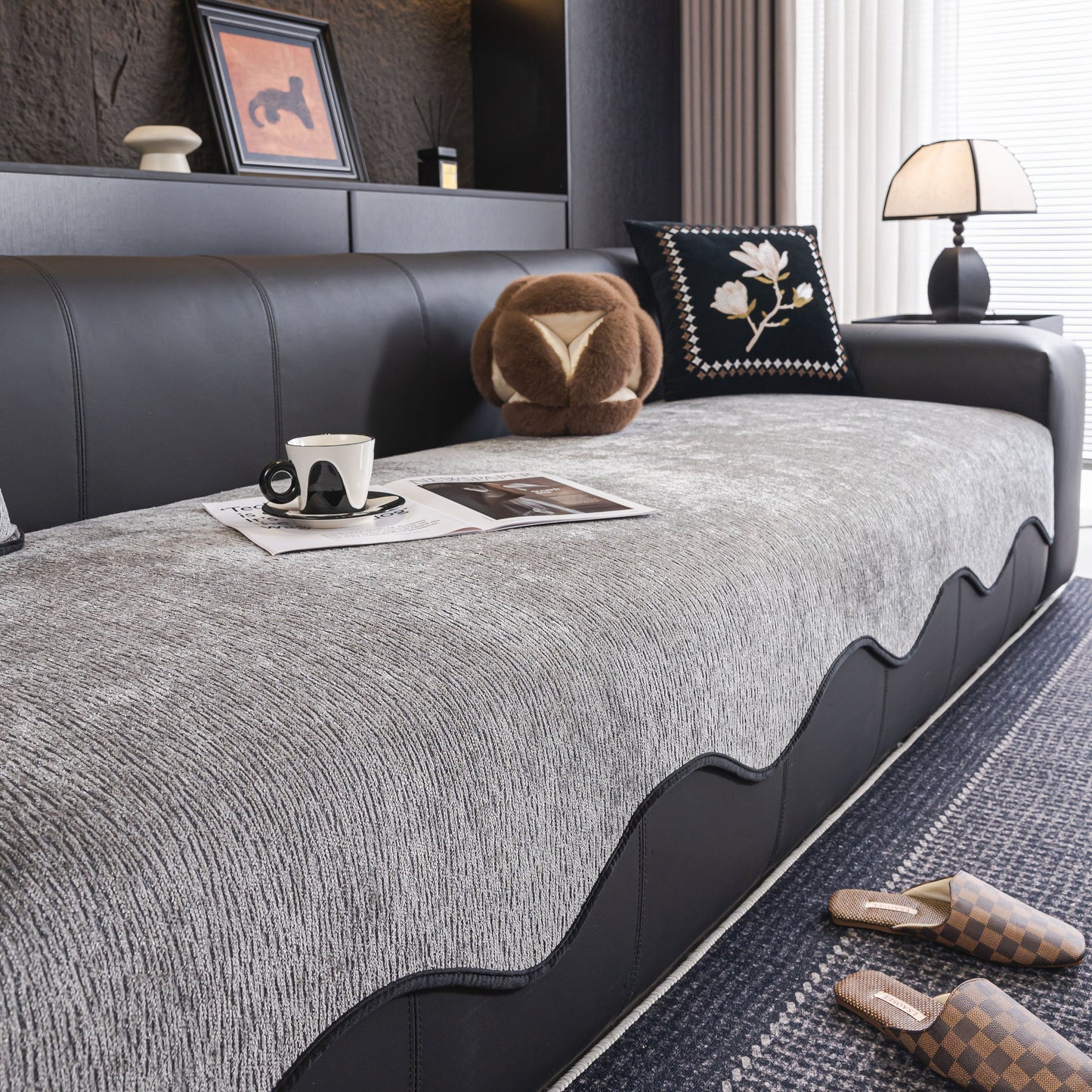 Chenille Couch Cover with Scalloped Edge, Non-Slip Modular Slipcover Sectional on a black sofa in a modern living room.