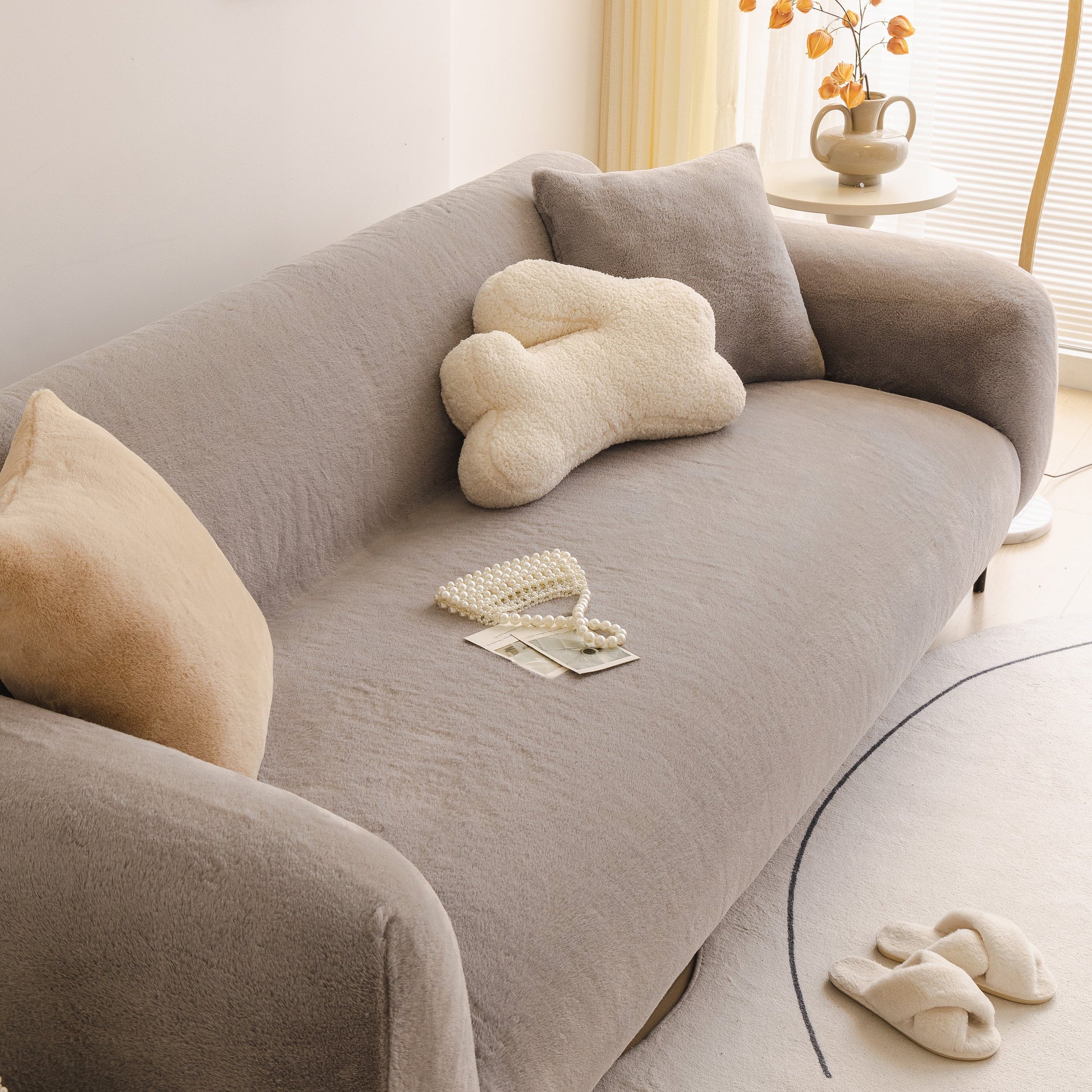 Soft Plush Warm Sofa Cover Stretchable Cozy Velvet Couch Protector for Fall & Winter covering beige sofa with pillows in a living room
