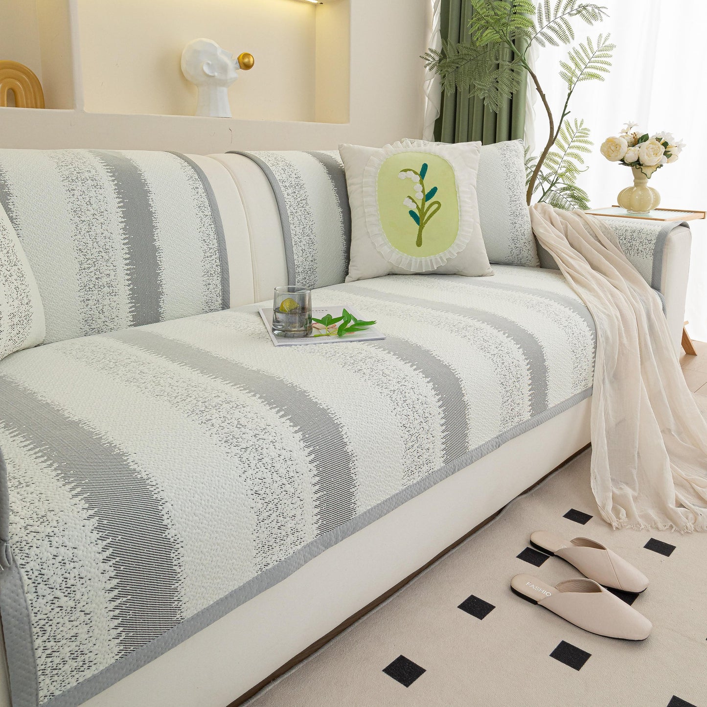Striped Non-Slip Cooling Couch Cover, Summer Couch Pads for Seat Back Armrest on a sofa with decor pillows.