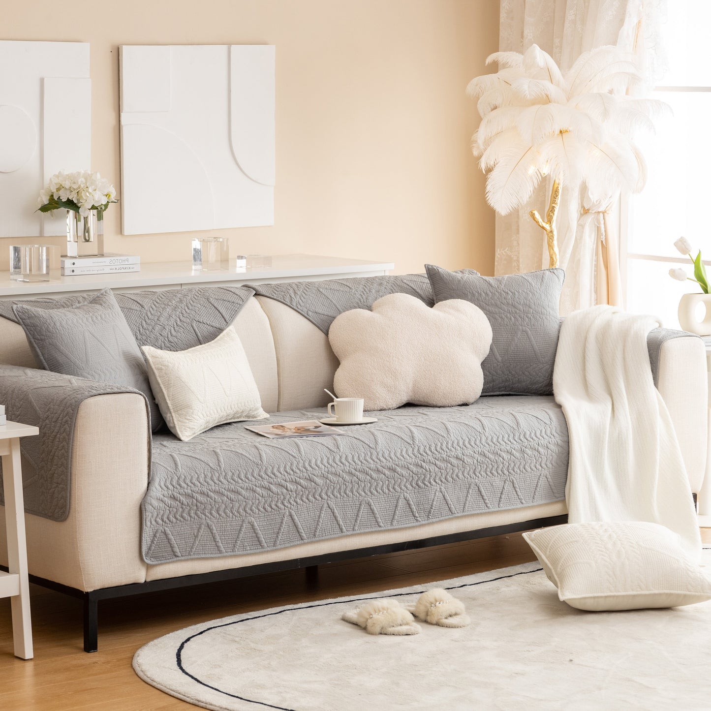Elegant living room featuring Geometric Textured Cotton Quilted Sofa Cover, Non-Slip Washable Couch Protector in modern gray design.