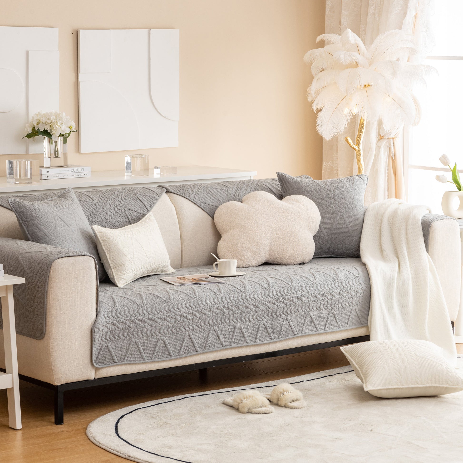 Elegant living room featuring Geometric Textured Cotton Quilted Sofa Cover, Non-Slip Washable Couch Protector in modern gray design.