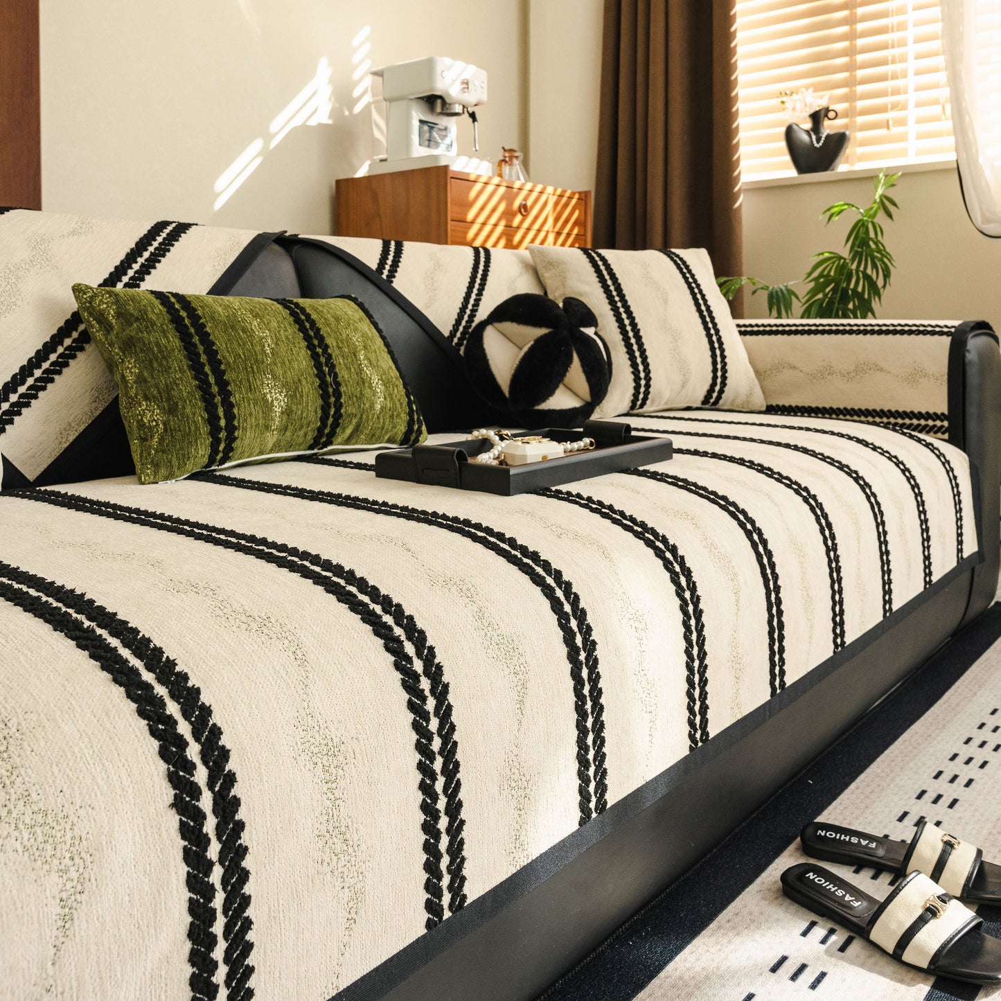 Non-Slip Sofa Cover with Thick Chenille Texture Woven Stripe Couch Protector Throw showcased on a stylish modern sofa.