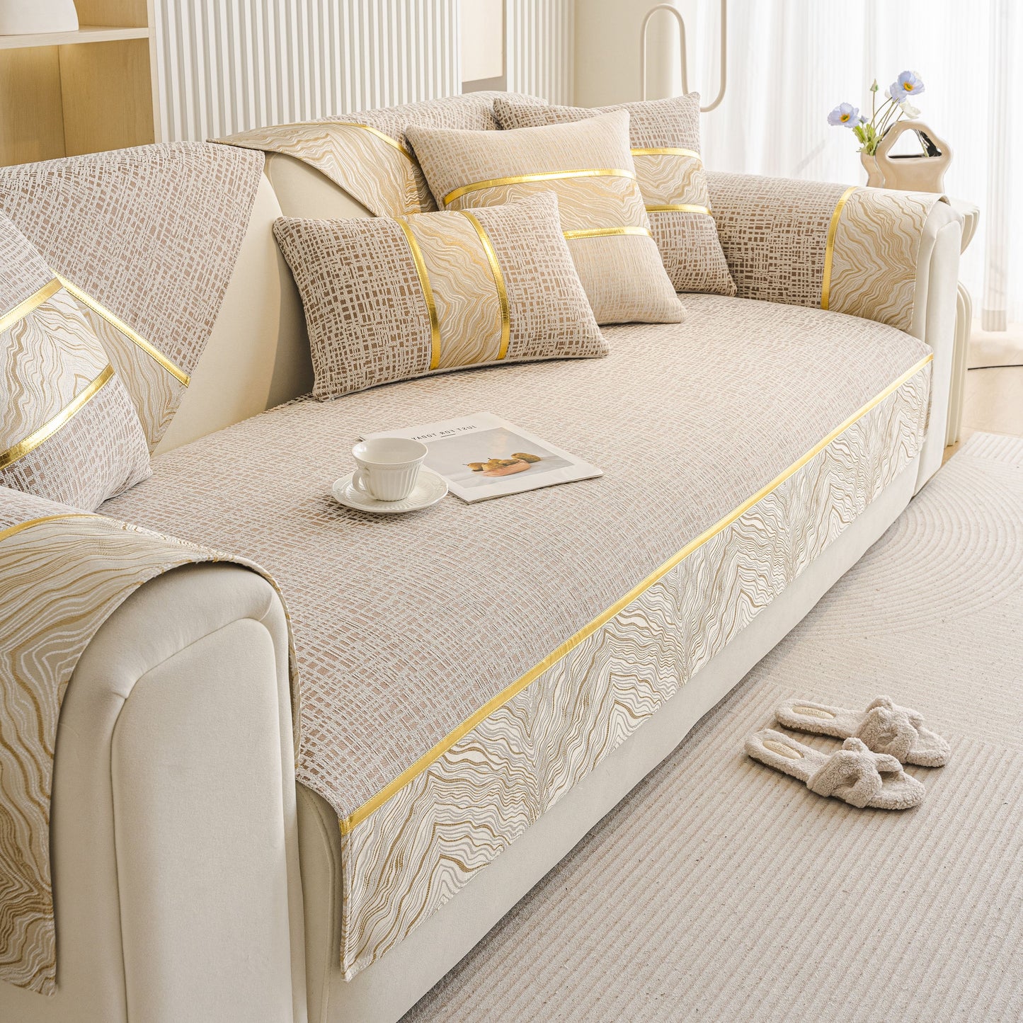 Modern Non-Slip Couch Slipcover, Soft, Durable & Washable Furniture Protector with gold marble trim on a couch with cushions