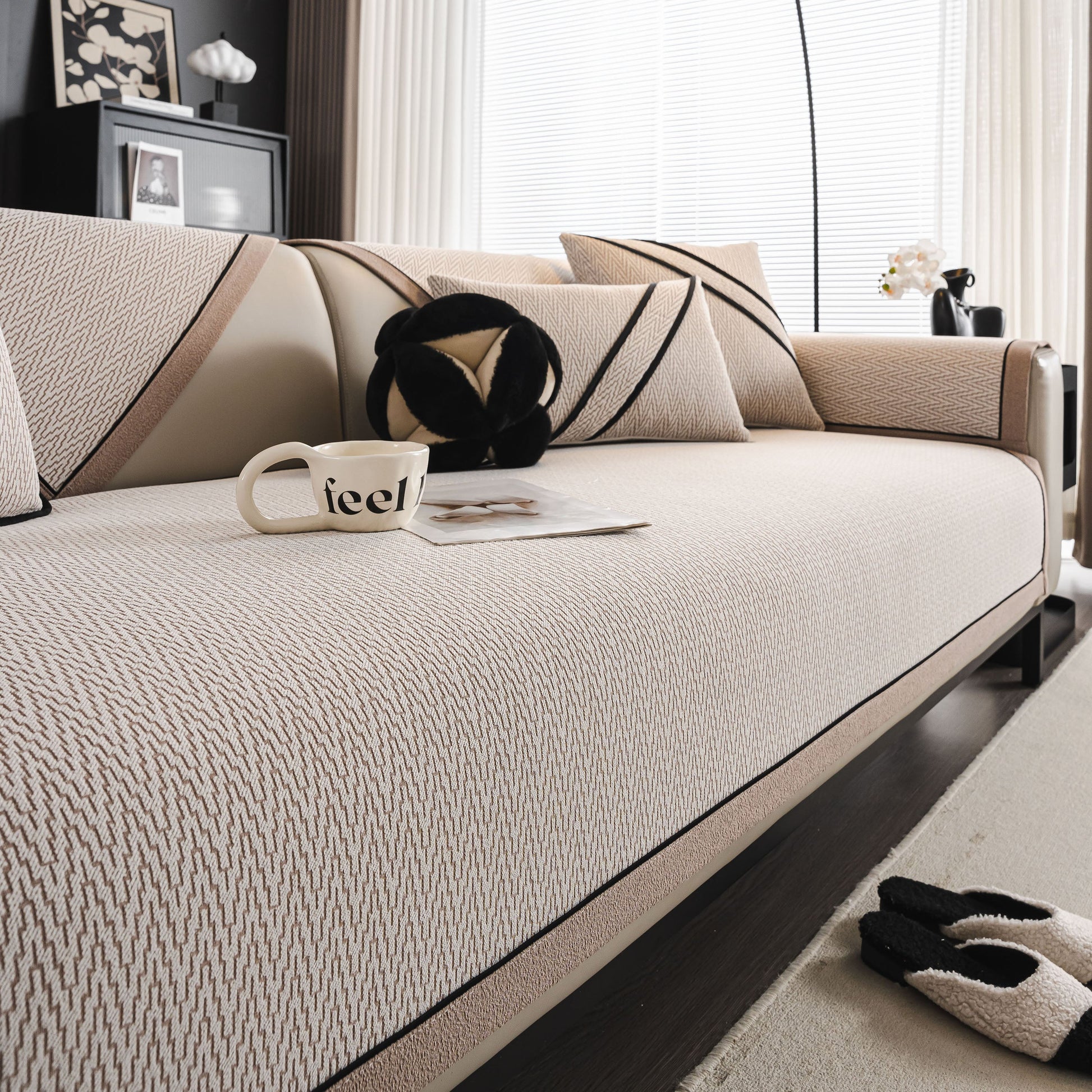 Modern living room with beige herringbone couch protector for pets, non-slip washable sectional couch covers and decorative pillows.