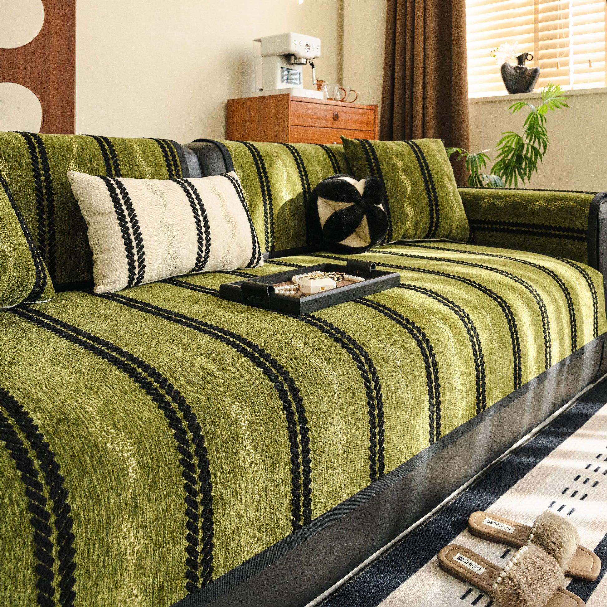 Non-Slip Sofa Cover with Thick Chenille Texture Woven Stripe Couch Protector Throw on green sofa with decorative pillows.