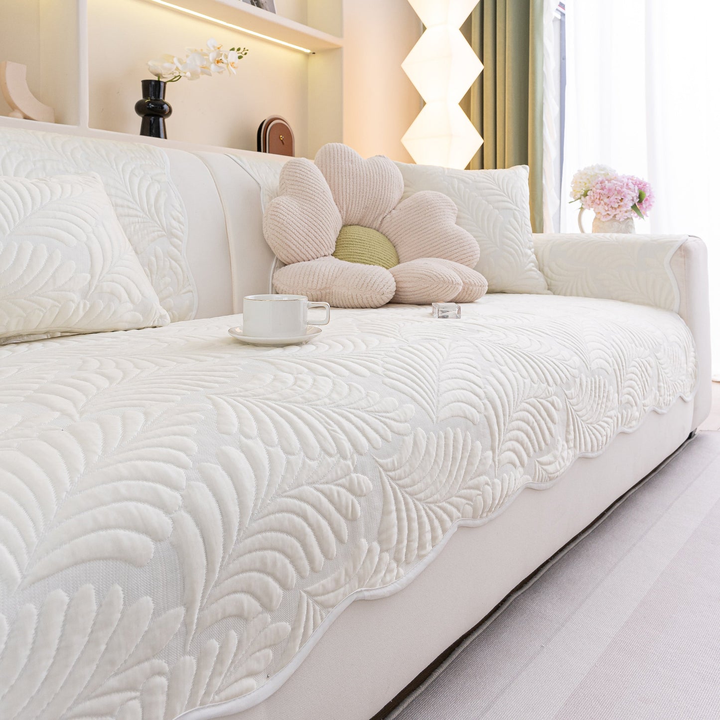 Sofa Cover for Leather & Fabric Couches, 3D Leaf Embossed Quilted Furniture Covers displayed on a white sofa