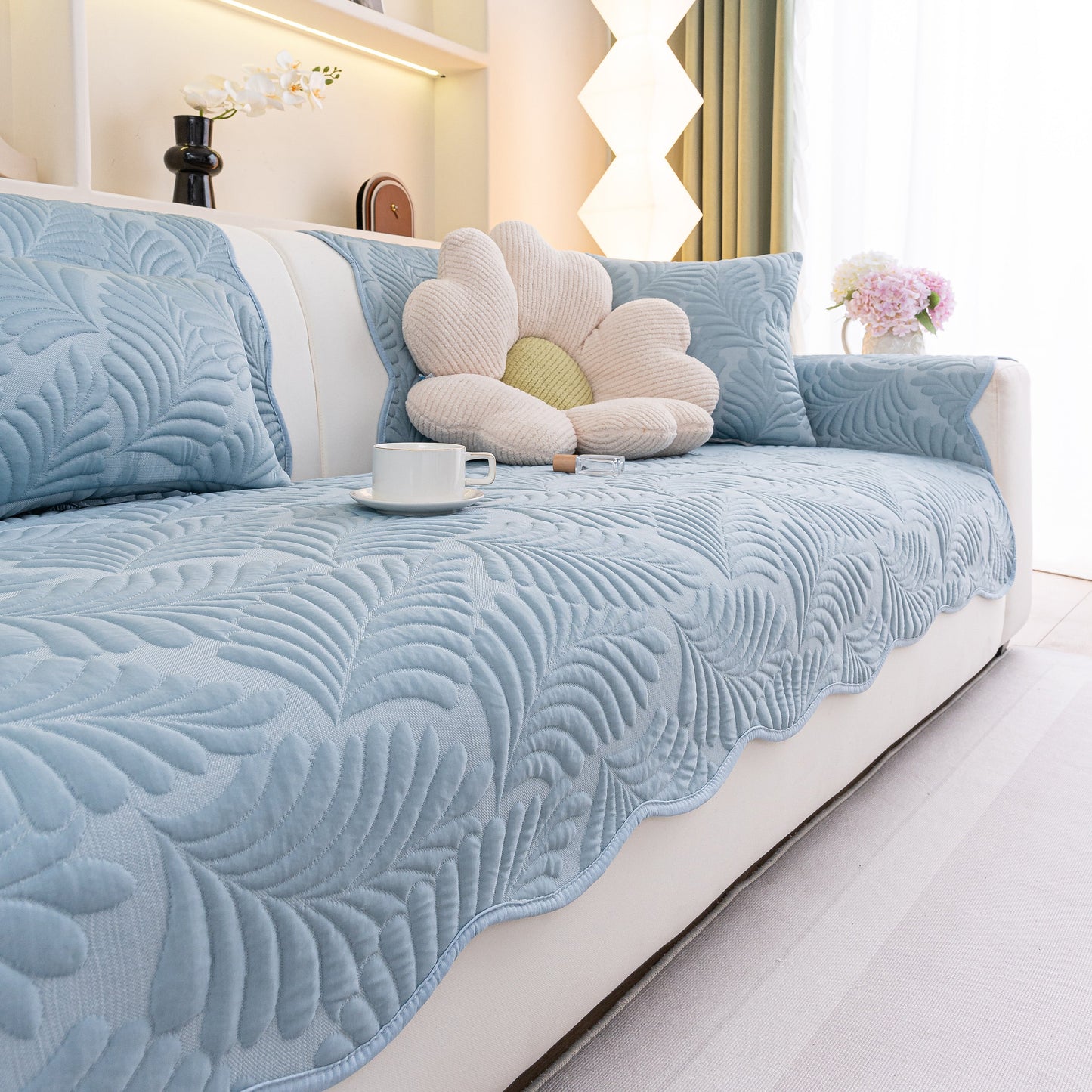 Sofa Cover for Leather & Fabric Couches, 3D Leaf Embossed Quilted Furniture Covers displayed on a couch.