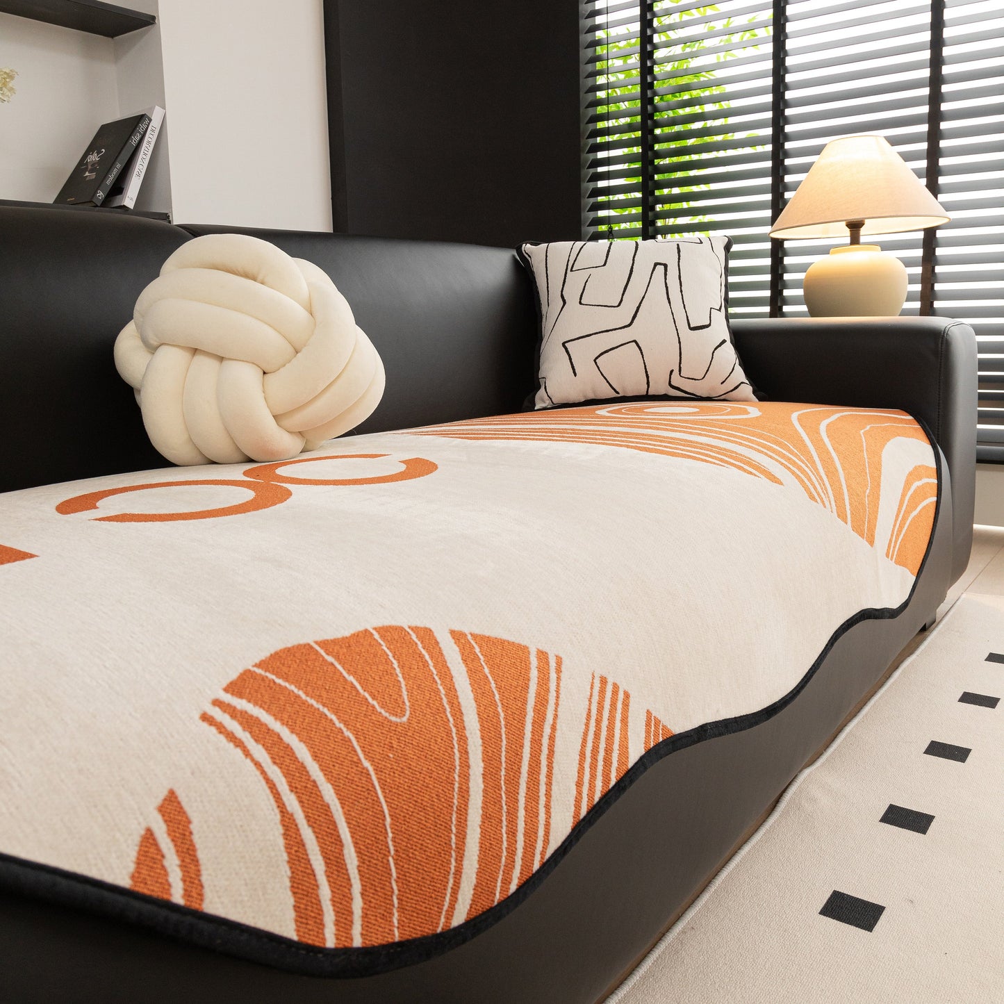 Abstract Art Sofa Cover with Wave Edge, Non Slip Couch Cover for Stylish Homes on black sofa with decorative pillows