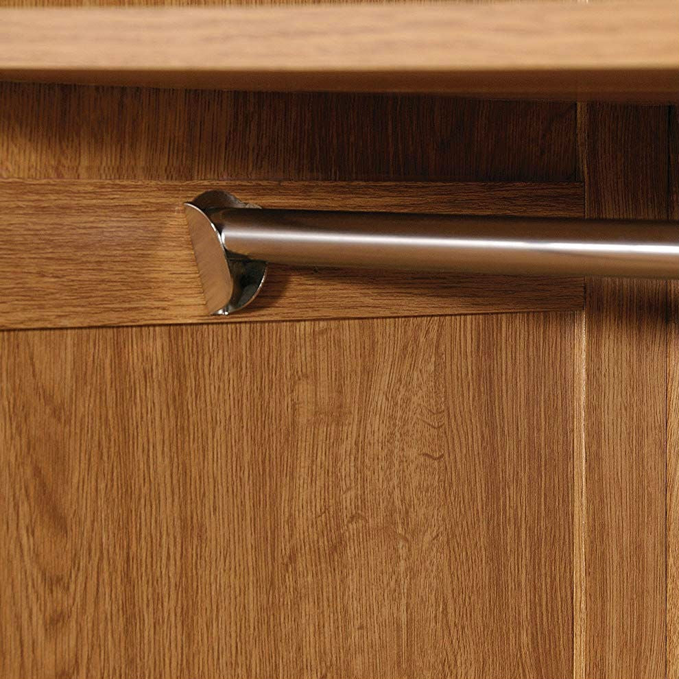 Close-up of garment rod in Bedroom Wardrobe Cabinet Storage Closet Organizer in Medium Oak Finish