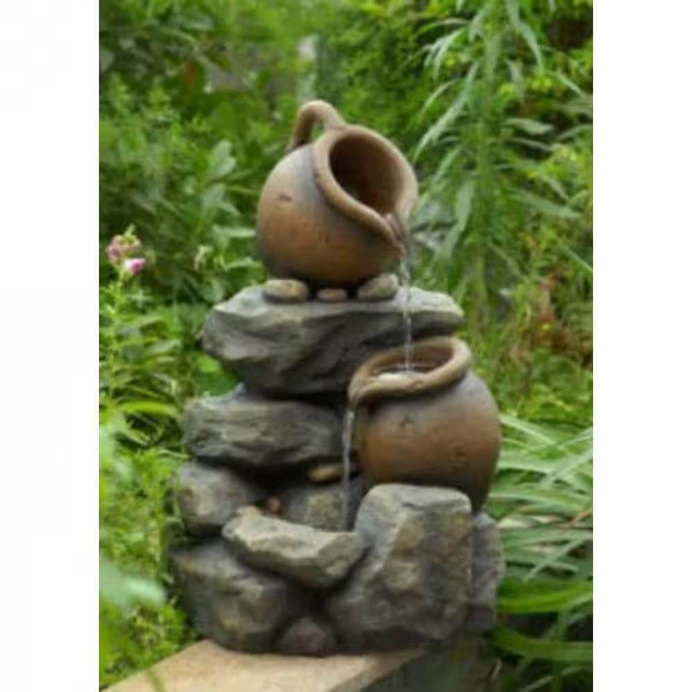 Outdoor Garden Polyresin Rock and Pitchers Waterfall Fountain with Pump in a lush garden setting