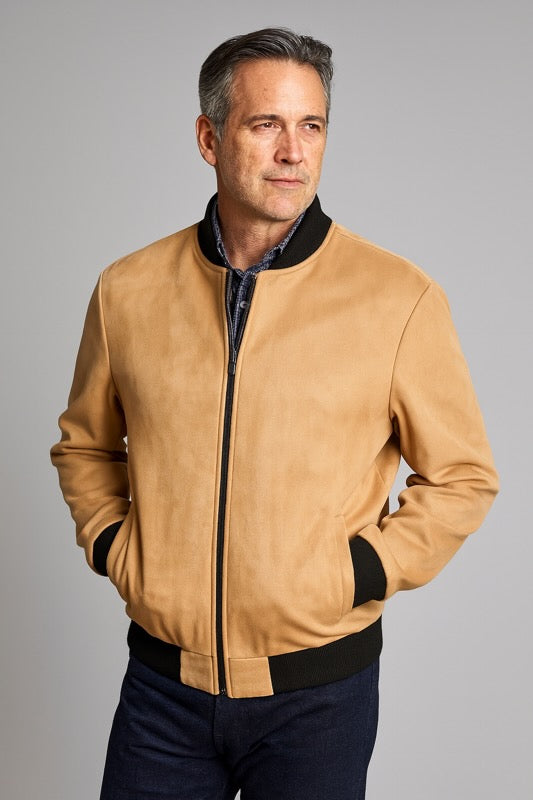 Man wearing a tan microfiber Baseball Jacket with ribbed waist and wrist finish, showcasing its stylish and lightweight design.
