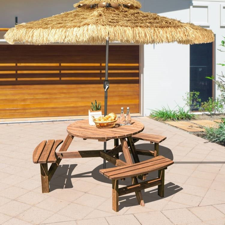 Image of Solid Cedar Wood Outdoor Picnic Table with 3 Benches Patio Garden Dining Set under a straw parasol in a sunny patio setting.