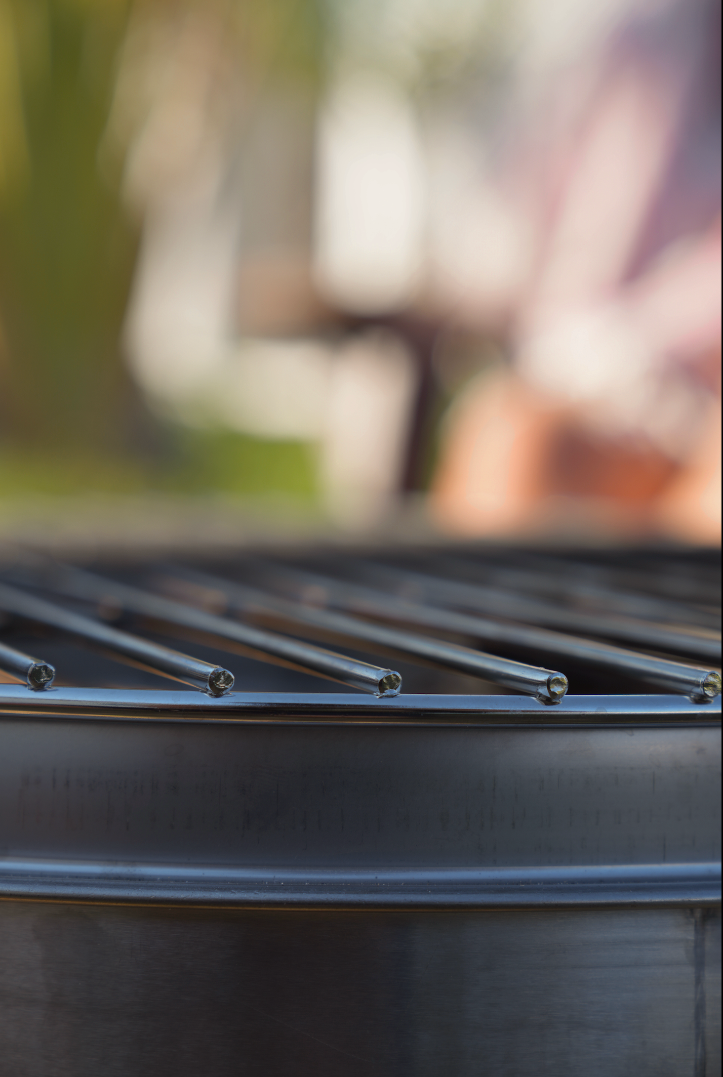 Close-up of Small Smokeless Fire Pit grill, perfect for outdoor relaxation and post-sauna meditation sessions.