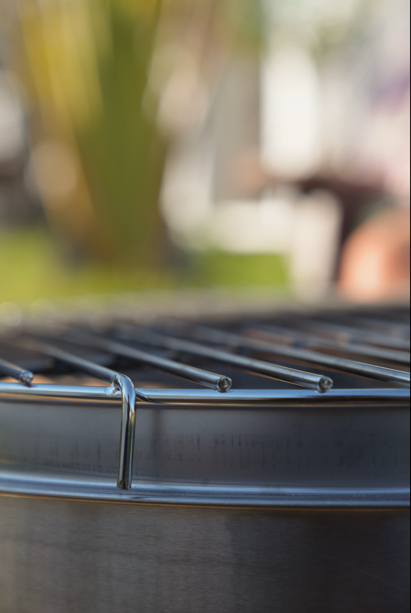 Close-up of Large Smokeless Fire Pit grill surface in a sunny outdoor setting.