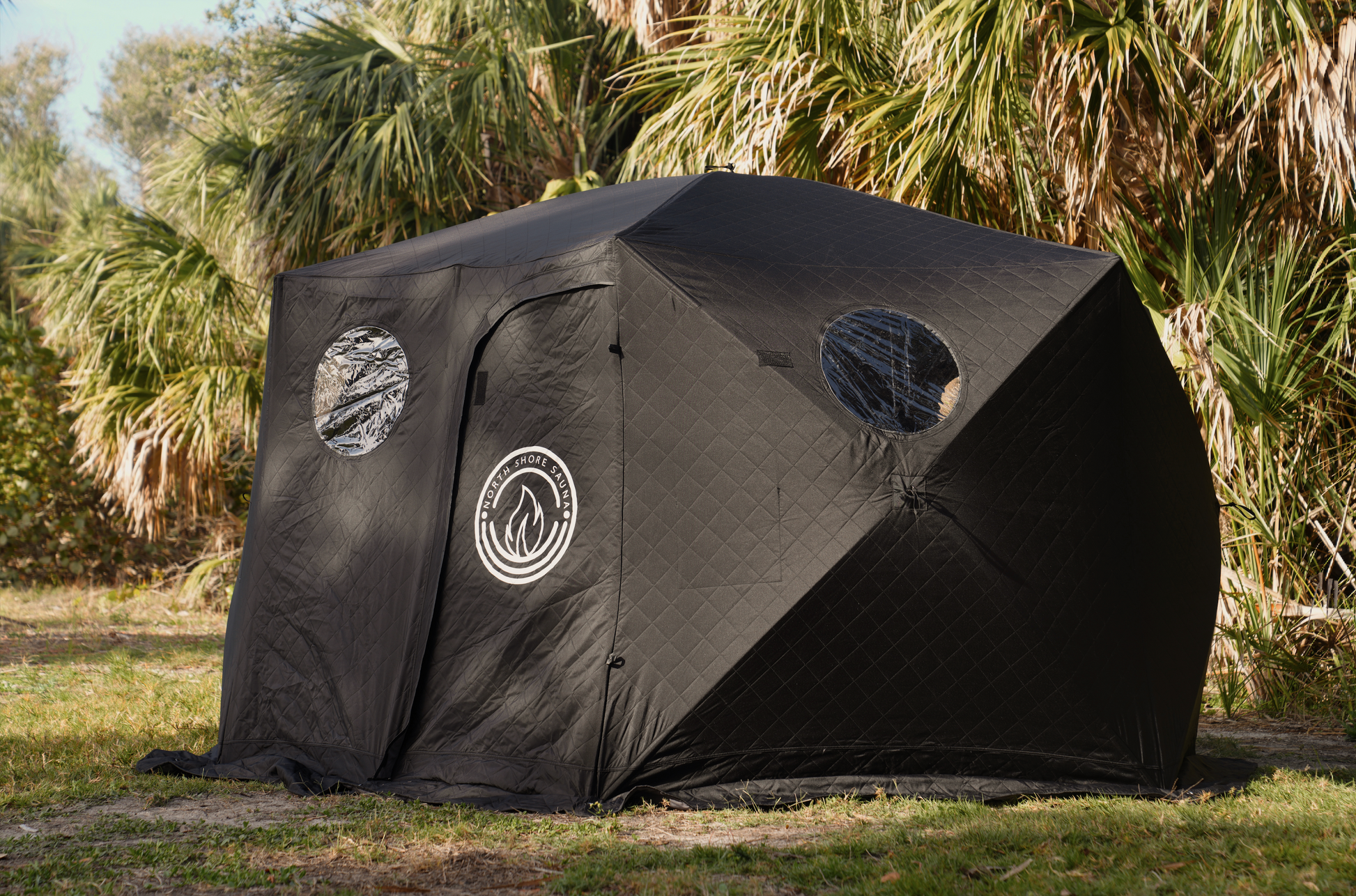 Black Dome Sauna Tent (8-person; tent only) set up outdoors for relaxation and gatherings, showcasing its spacious and portable design.
