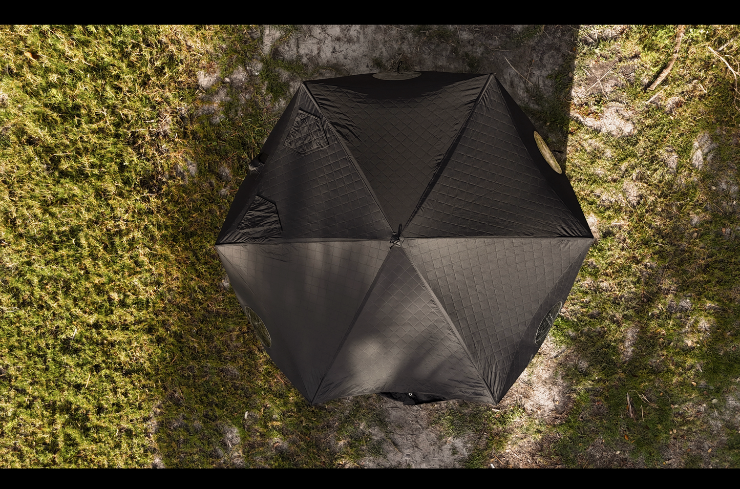 Overhead view of Dome Sauna Tent (8-person; tent only) set up on grass, showcasing its large size and high-quality material.