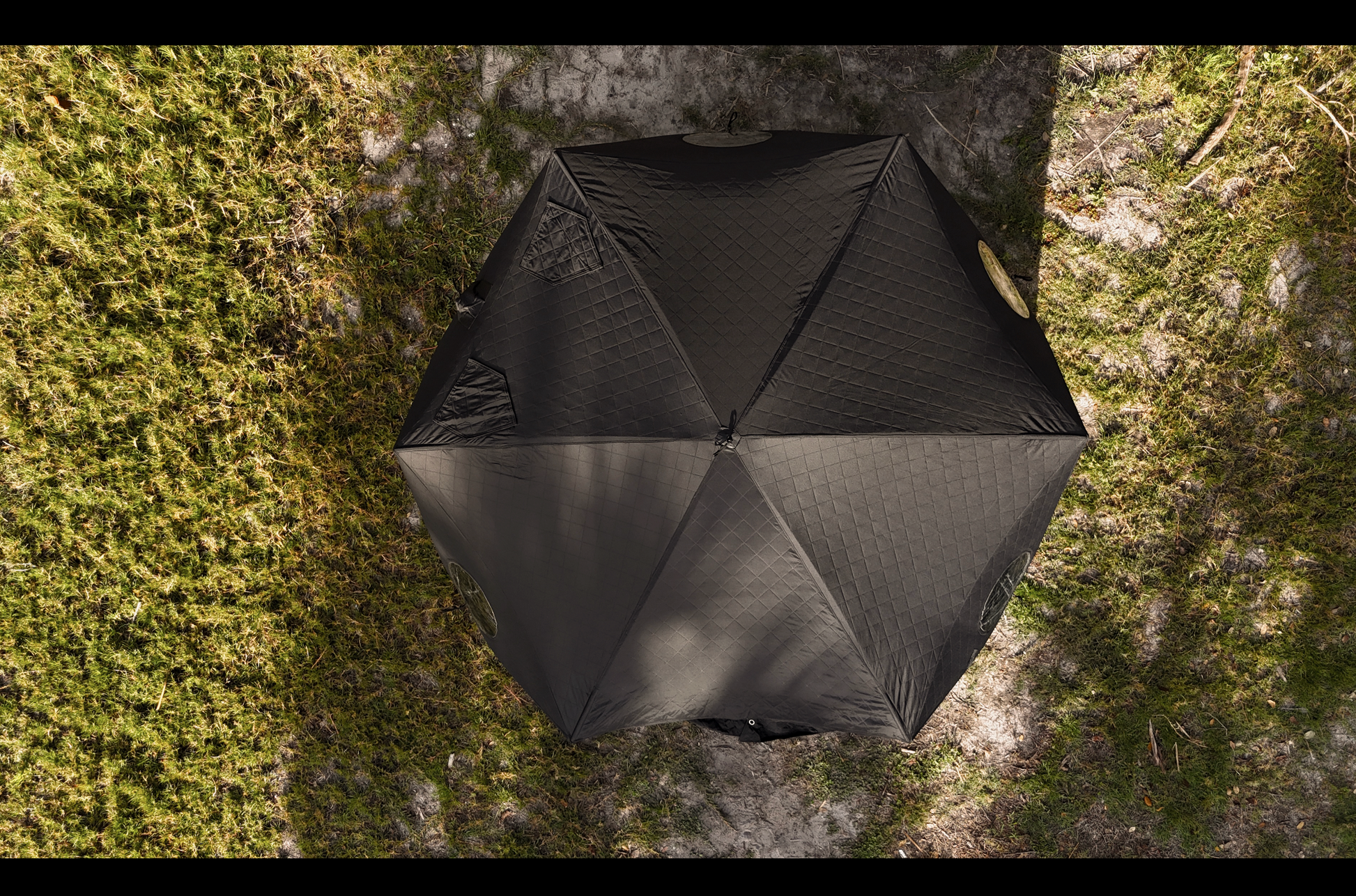 Overhead view of Dome Sauna Tent (8-person; tent only) set up on grass, showcasing its large size and high-quality material.