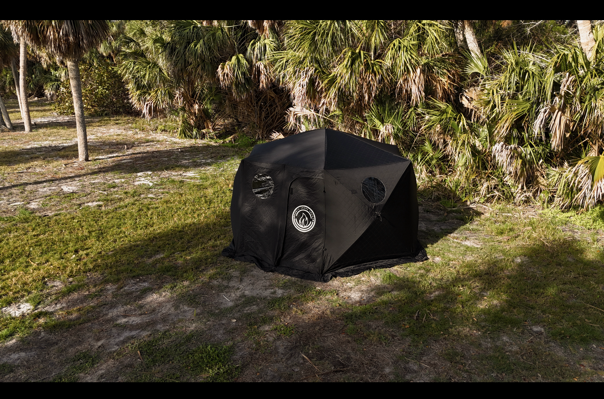 Dome Sauna Tent (8-person; tent only) setup outdoors, ideal for ice-fishing and winter camping, with dual chimney ports for stoves.