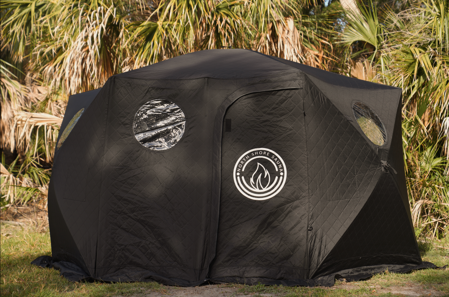 Dome Sauna Tent (8-person; tent only) set up outdoors, showcasing its large size and dual chimney ports for cold weather use.