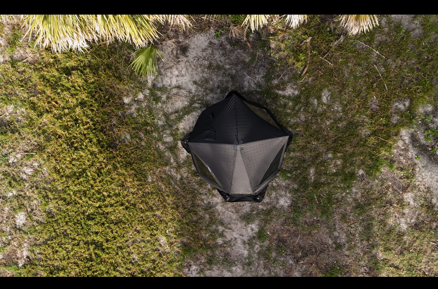 Aerial view of Nova 4 Sauna Tent (4-person; tent only) set up in a green outdoor area.