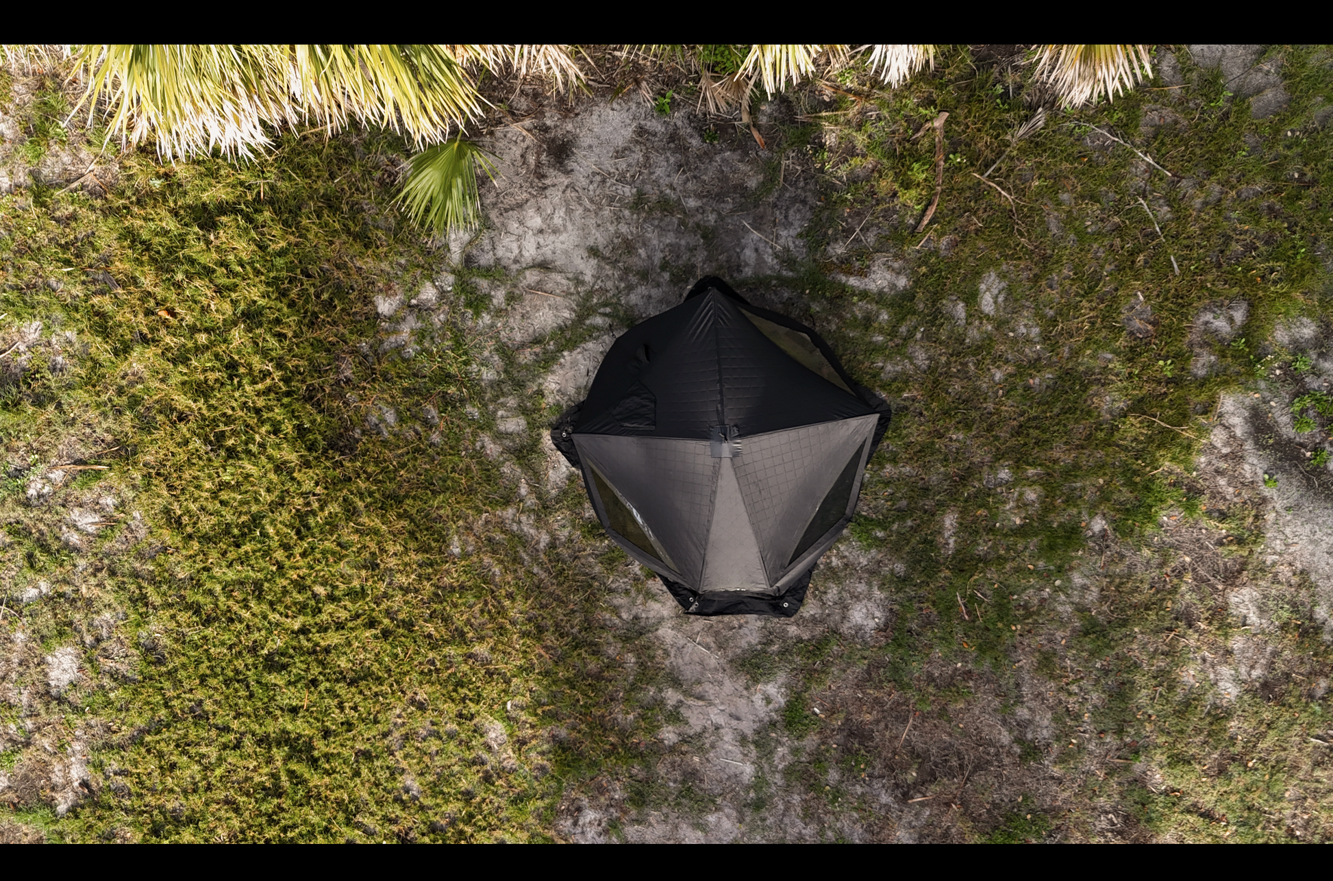 Aerial view of Nova 4 Sauna Tent (4-person; tent only) set up in a green outdoor area.