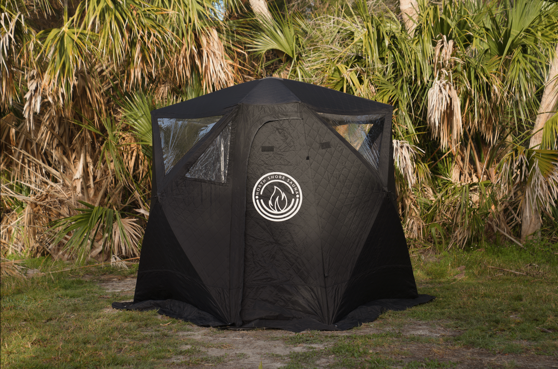 Nova 4 Sauna Tent (4-person; tent only) in a lush outdoor setting, showcasing its durable, heat-resistant design and full-size zipper door.