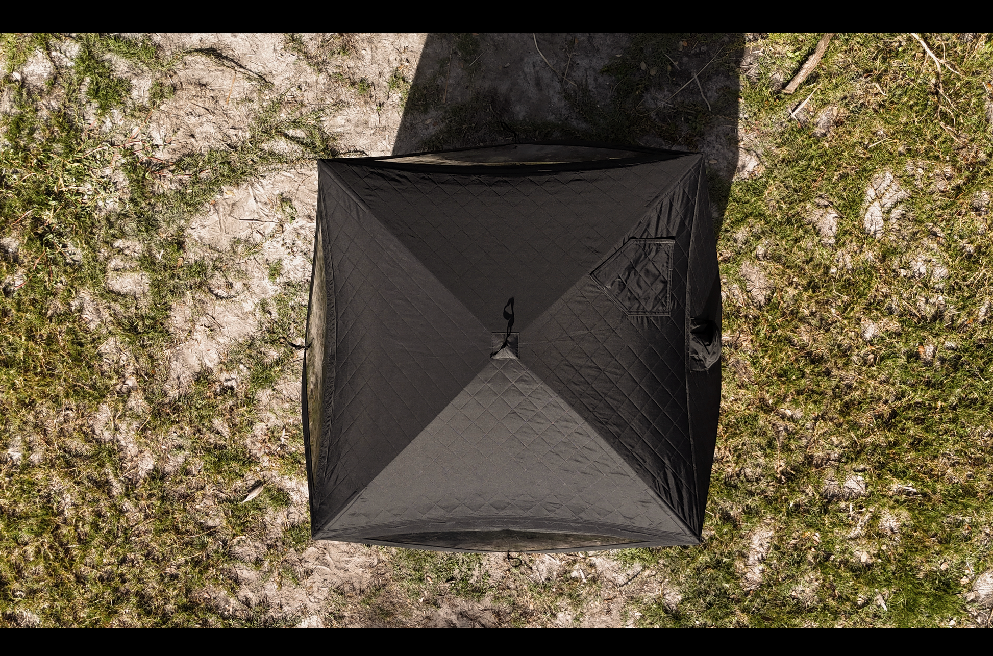 Top view of Mini Cube Sauna Tent (2-person; tent only) set up on grassy outdoor area.