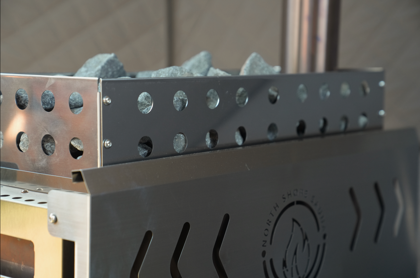 Close-up of the sauna stove and rock basket included in the Dome Sauna Tent Starter Package (8-person)