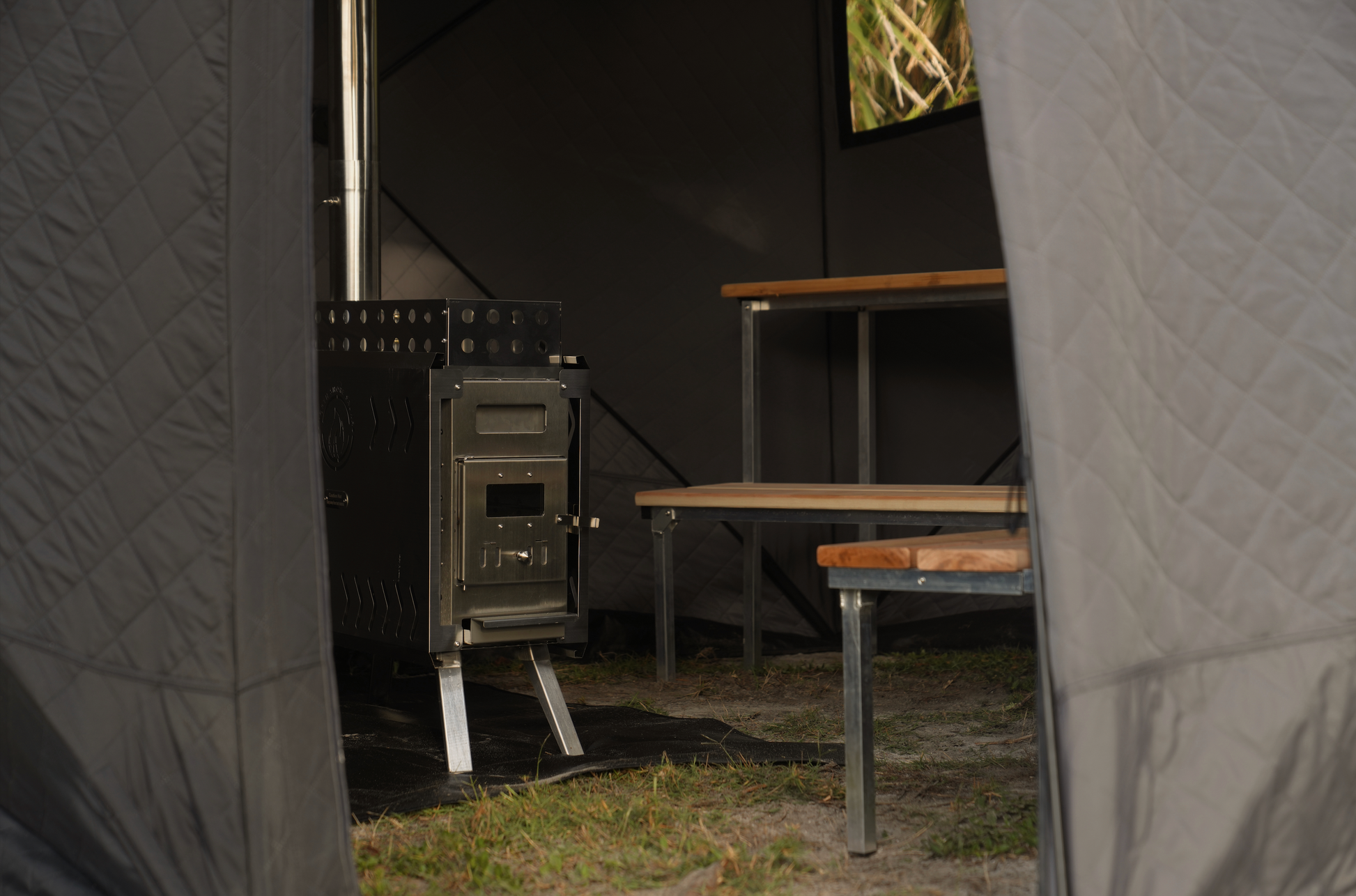 Nova 6 Sauna Tent Pro Package (6-person) showcasing interior with wood-fired stove and bench setup.