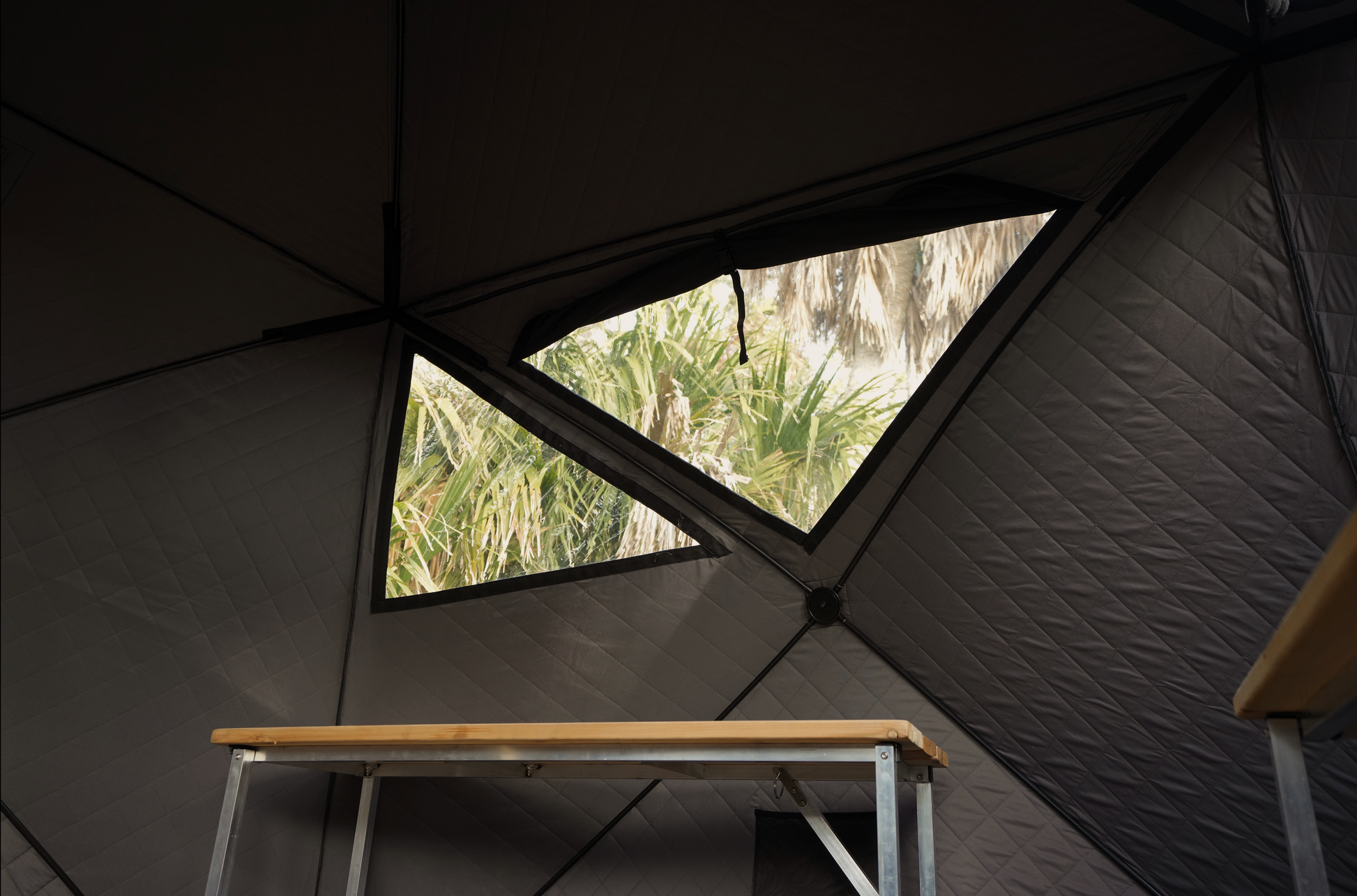 View from inside the Nova 6 Sauna Tent Premium Package (6-person) showing portable bench and tent wall with window.