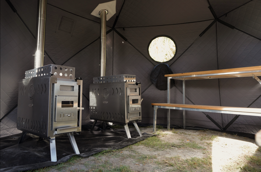 Interior view of Dome Sauna Tent Premium Package (8-person) showcasing dual stoves and benches for a luxurious spa experience.