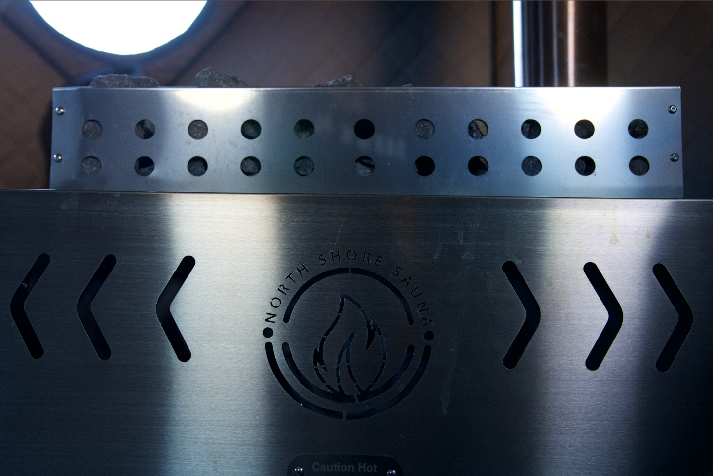 Close-up of Sauna Tent Wood Stove XL with stainless-steel design and rock basket for intense heat and steam relaxation.