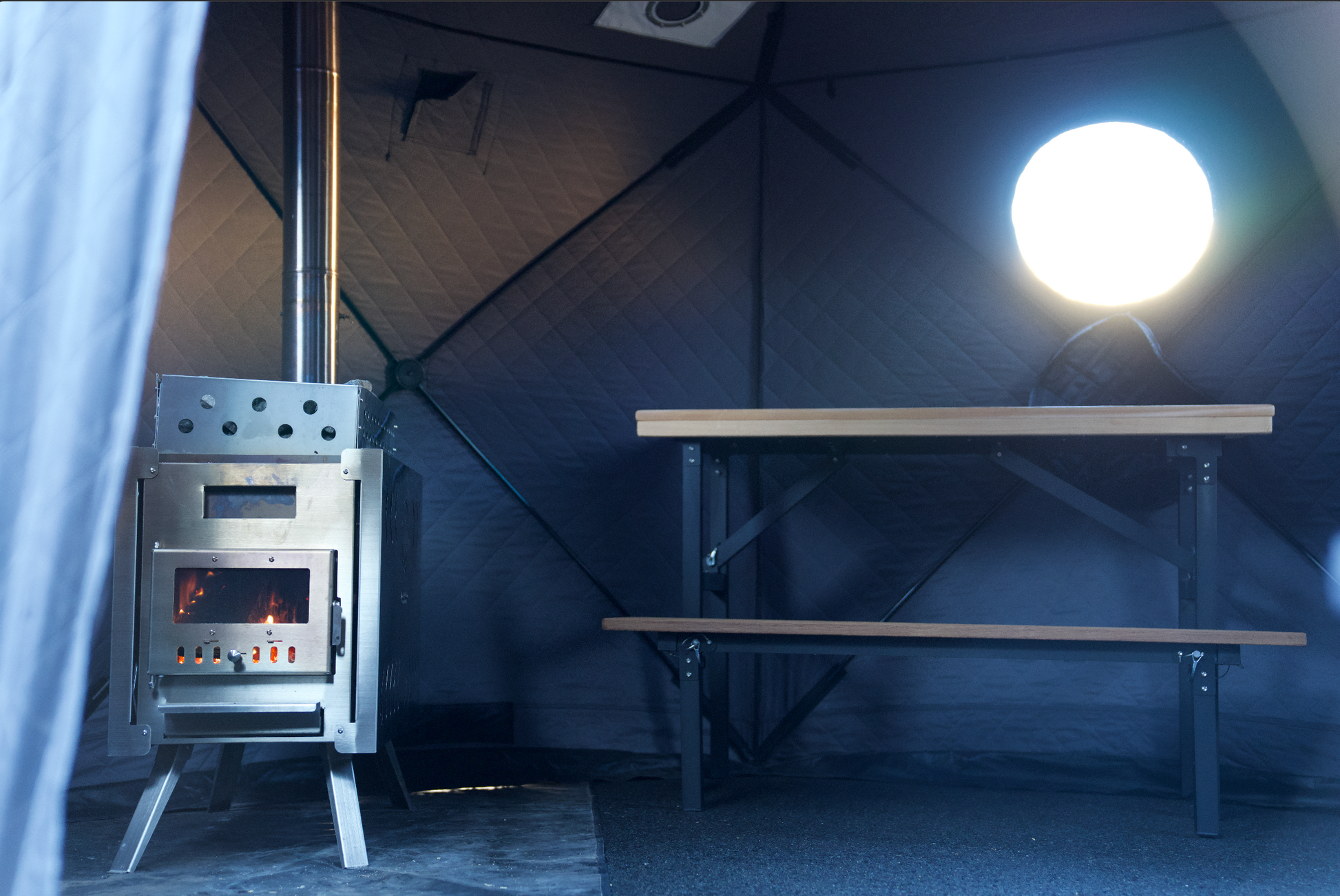 Portable Sauna Bench inside a tent with a heater, showcasing lightweight, durable design for optimal heat distribution and comfort.
