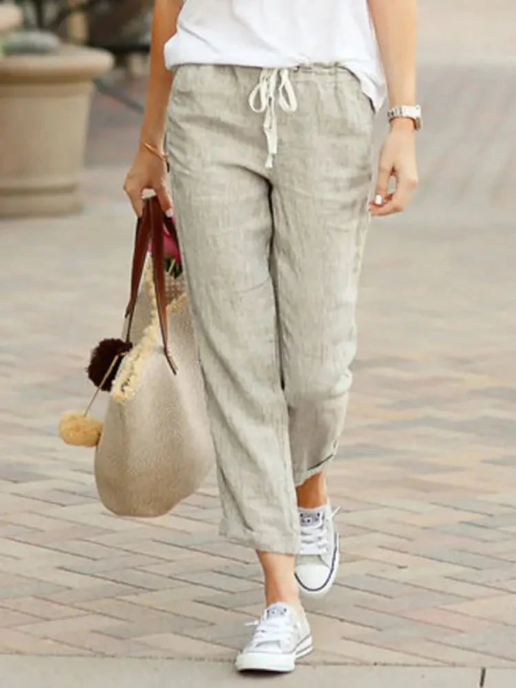 Woman wearing casual wide leg pants with drawstring in an urban setting