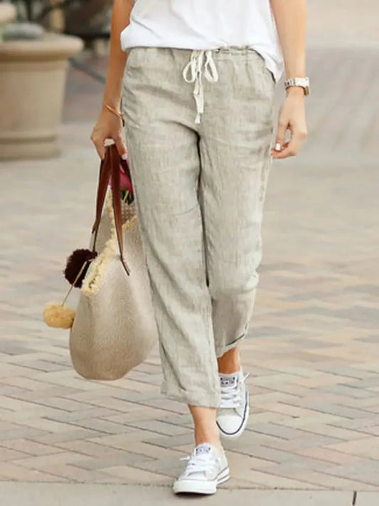 Woman wearing casual wide leg pants with drawstring in an urban setting