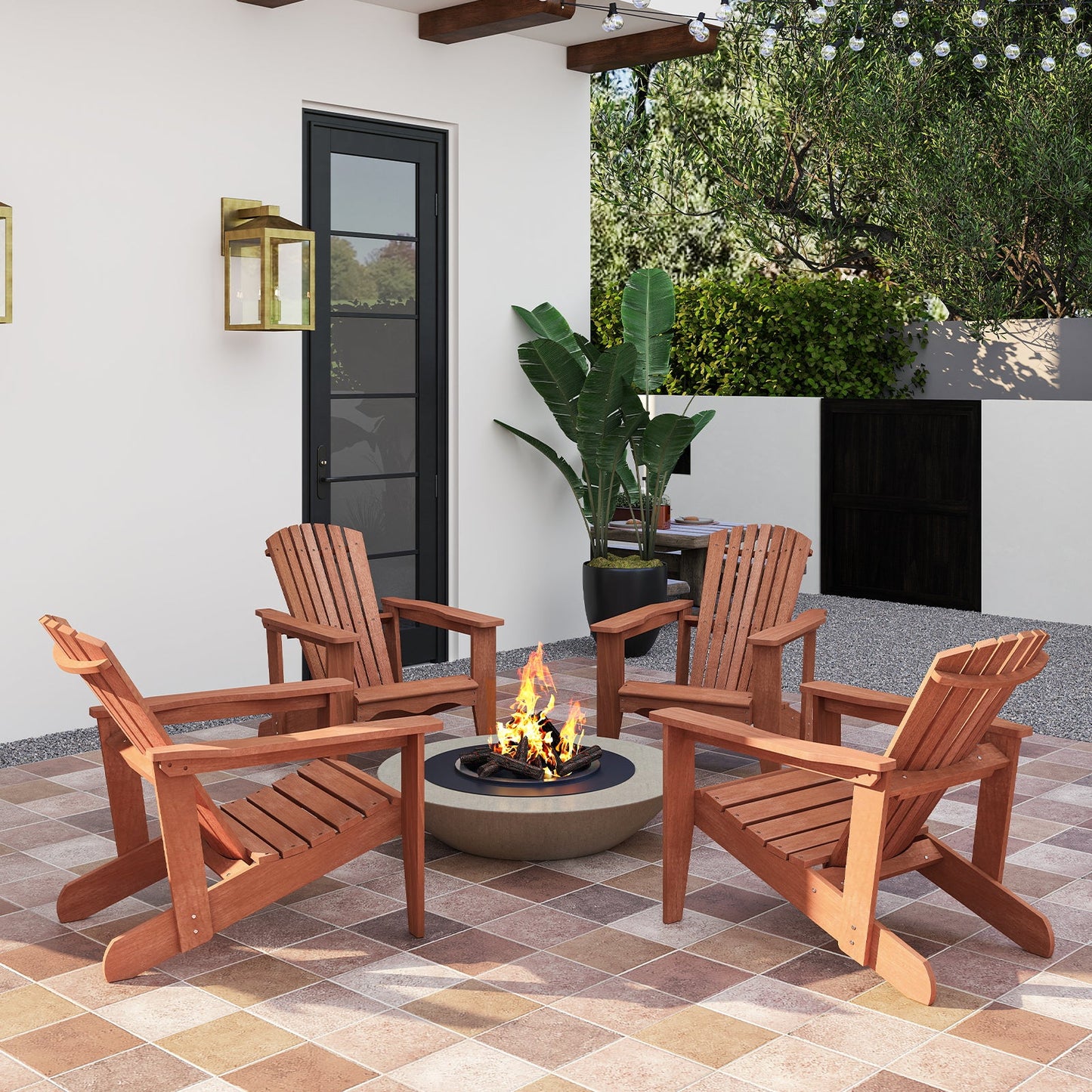 Outdoor patio with four Solid Wood Adirondack Chairs with High Backrest and Wide Armrests around a fire pit.