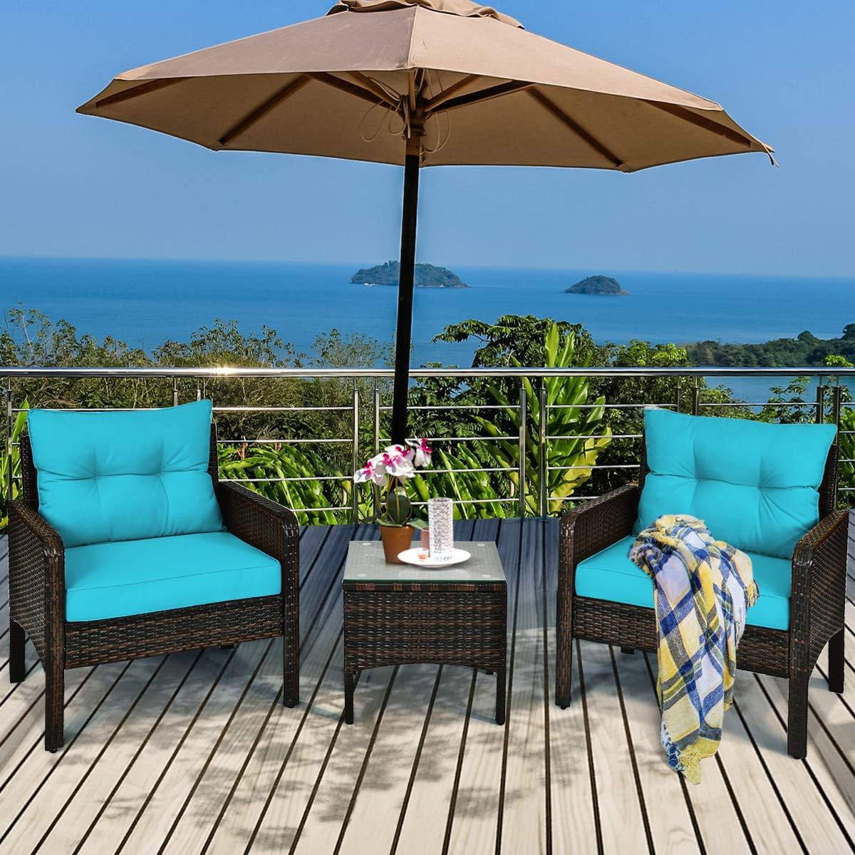 3-Piece Brown PE Rattan Outdoor Patio Furniture Dining Set w/ Turquoise Cushions on a deck with ocean view