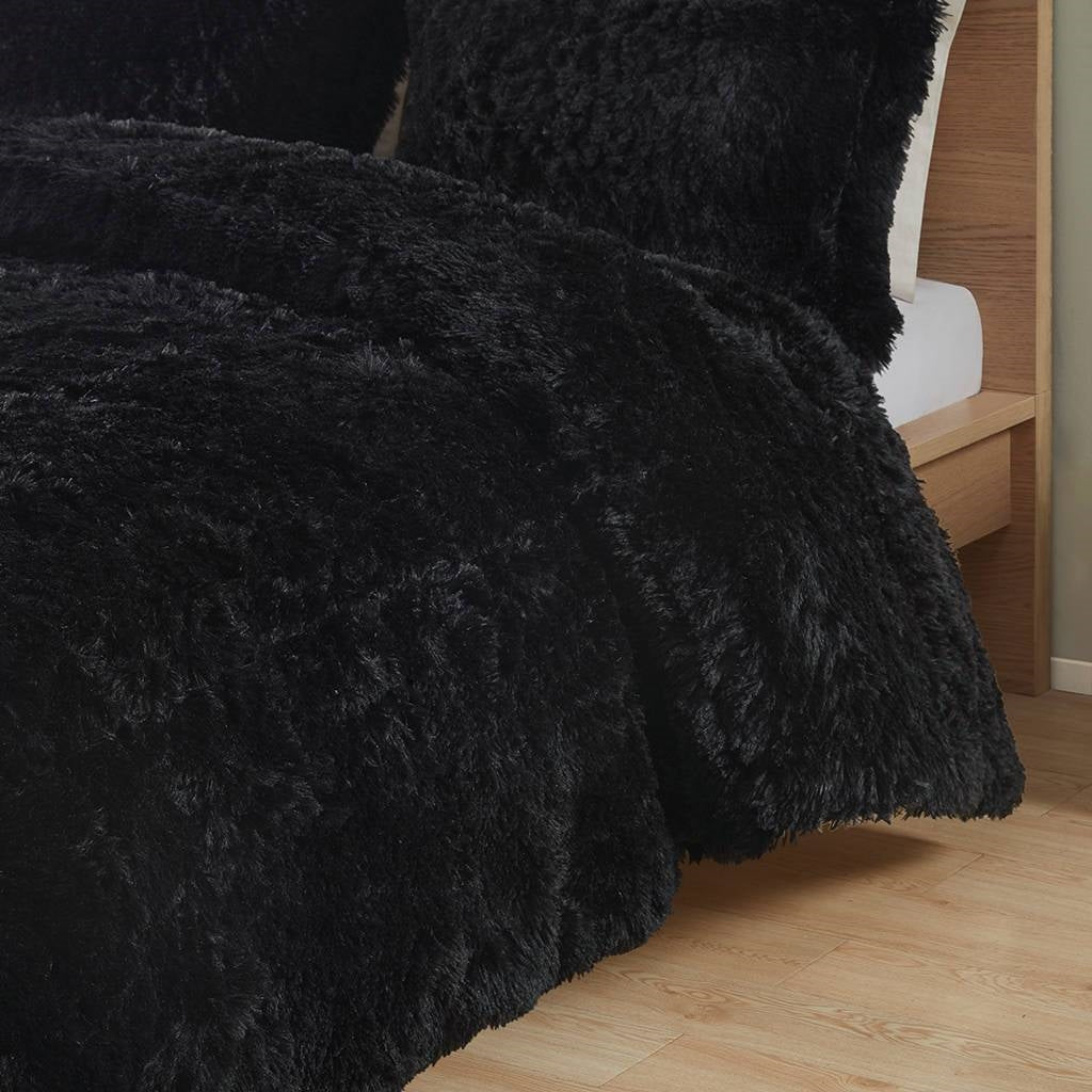 Twin/Twin XL Black Soft Sherpa Faux Fur 2-Piece Comforter Set with Shams on a bed