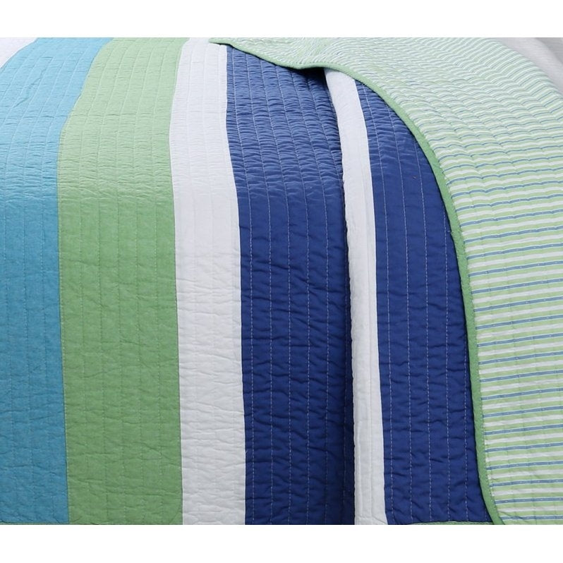 Twin Size Navy Blue/Green/Teal/White Stripe 100-Percent Cotton Quilt Set on a bed