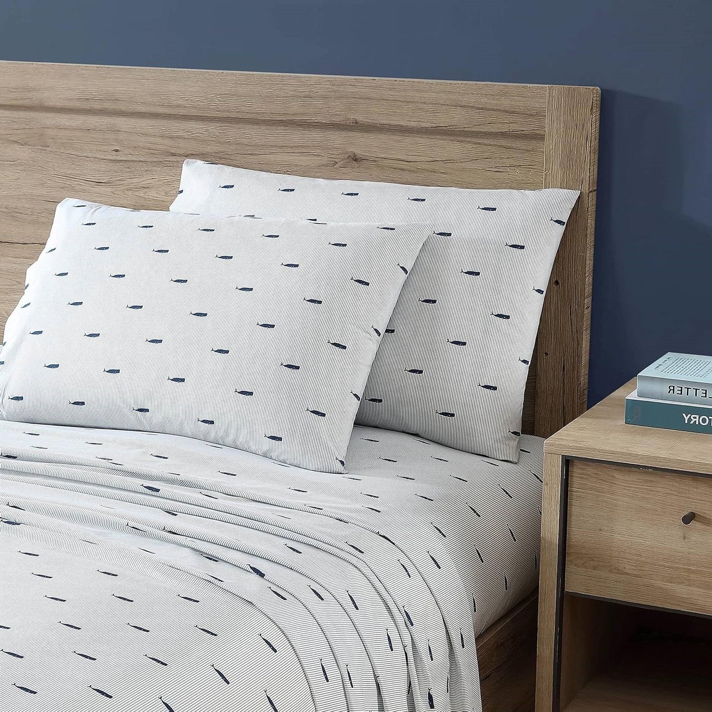 Twin size Coastal Beach 100-Percent Cotton Navy Blue White Stripe Sheet Set on wooden bed with pillows and nightstand