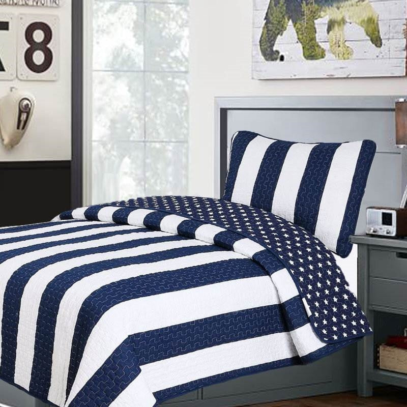 Twin 2 Piece Navy White Stars Stripes 100-Percent Cotton Reversible Quilt Set in a bedroom setting.