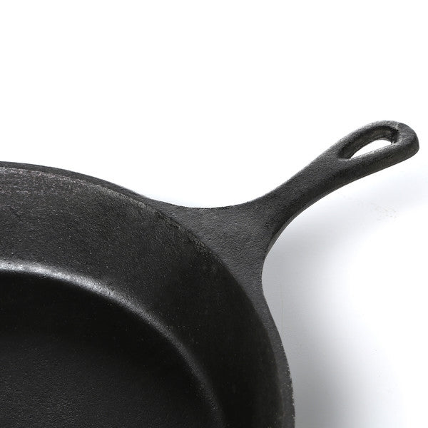 Close-up of handle on Pre-Seasoned Cast Iron 14-inch Round Skillet, perfect for easy cooking and fast clean-up.