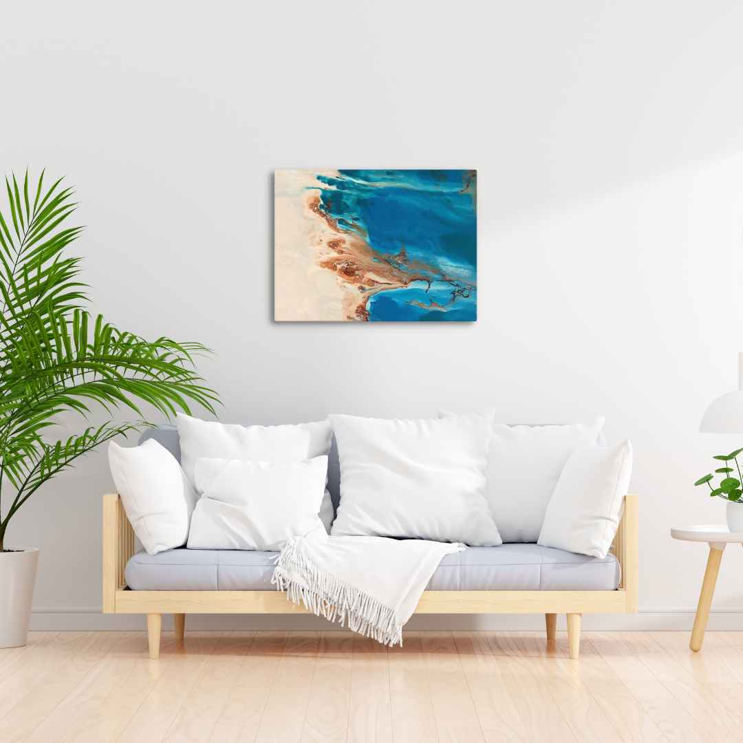 Los Roques Archipelago canvas print featuring crystal blue waters, mounted on a wall above a modern sofa in a stylish living room.