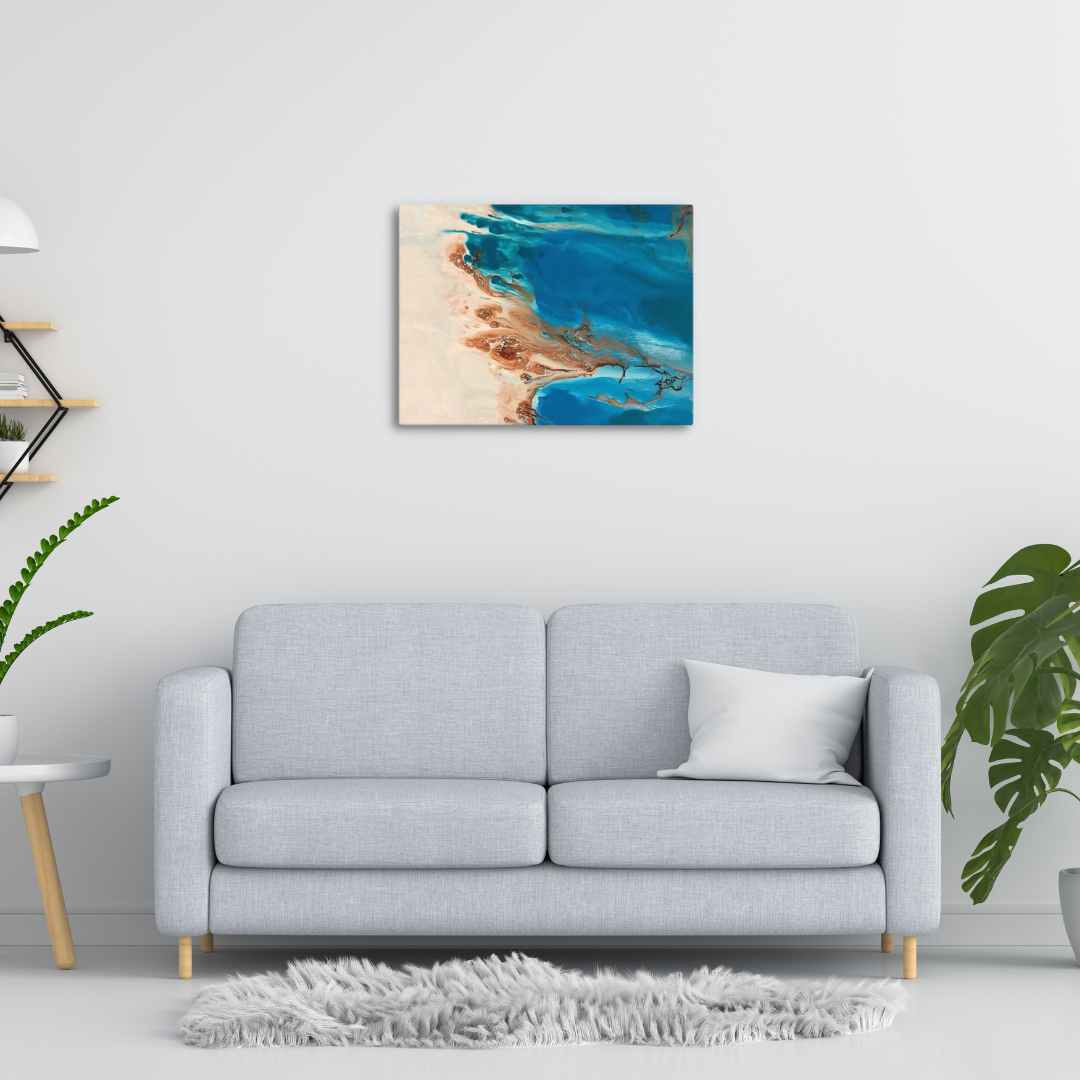 Los Roques Archipelago canvas print on wall above modern sofa, showcasing vibrant blue waters in an oil painting.