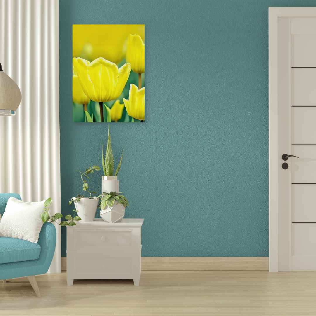 Sunny Garden Blooms print with vibrant yellow flowers on a green background, displayed on a teal wall.