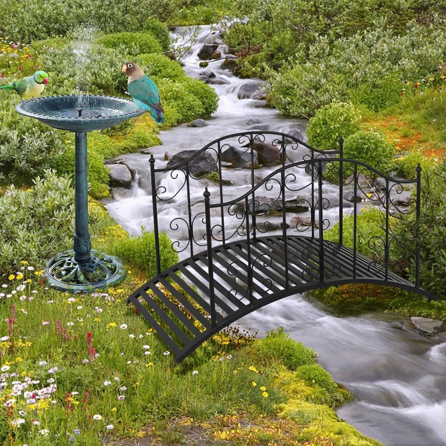 Sturdy Outdoor Rust-Proof 4-Foot Black Metal Arch Garden Bridge over a stream in a lush garden setting