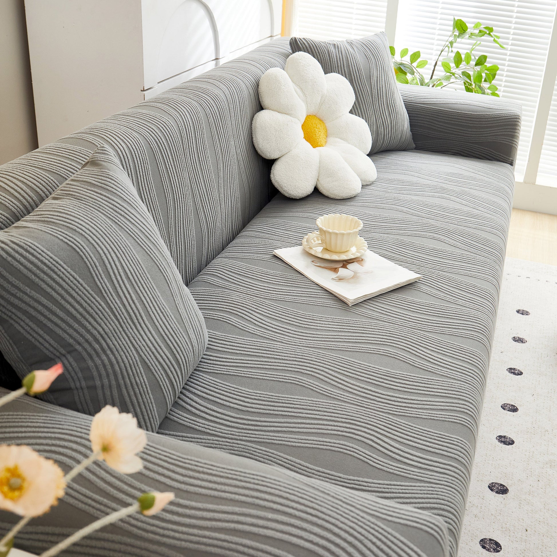Textured Wave Stretch Sofa Couch Cover in gray with daisy pillow, Soft Washable Spandex Furniture Slipcovers, modern living room decor.