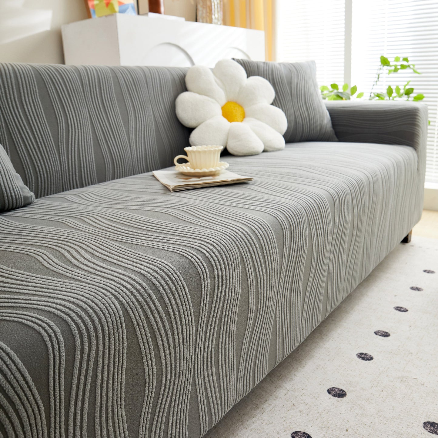 Textured Wave Stretch Sofa Couch Cover, Soft Washable Spandex Furniture Slipcovers on gray sofa with wave pattern in a cozy room.