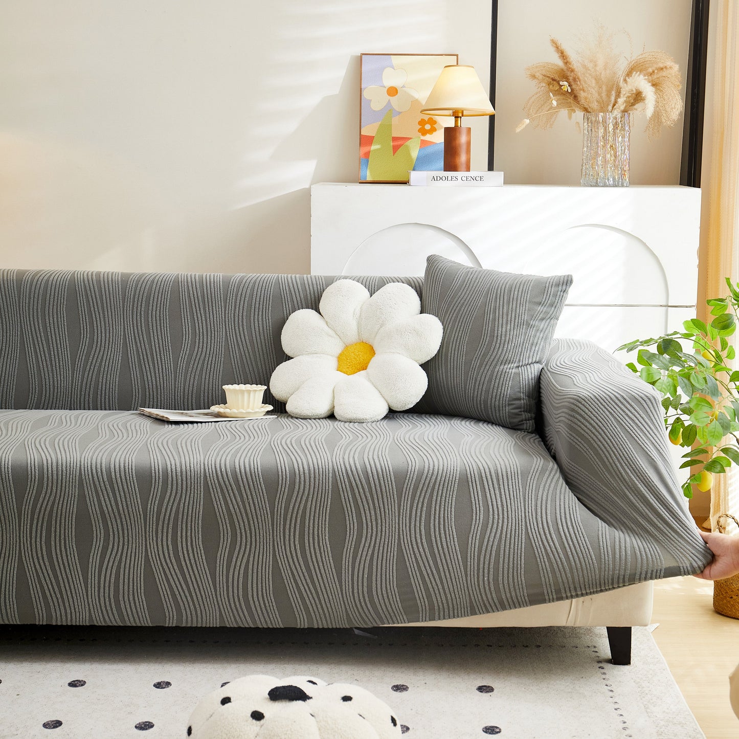 Textured Wave Stretch Sofa Couch Cover in gray on a modern sofa, featuring a soft washable spandex blend with a stylish wave pattern.
