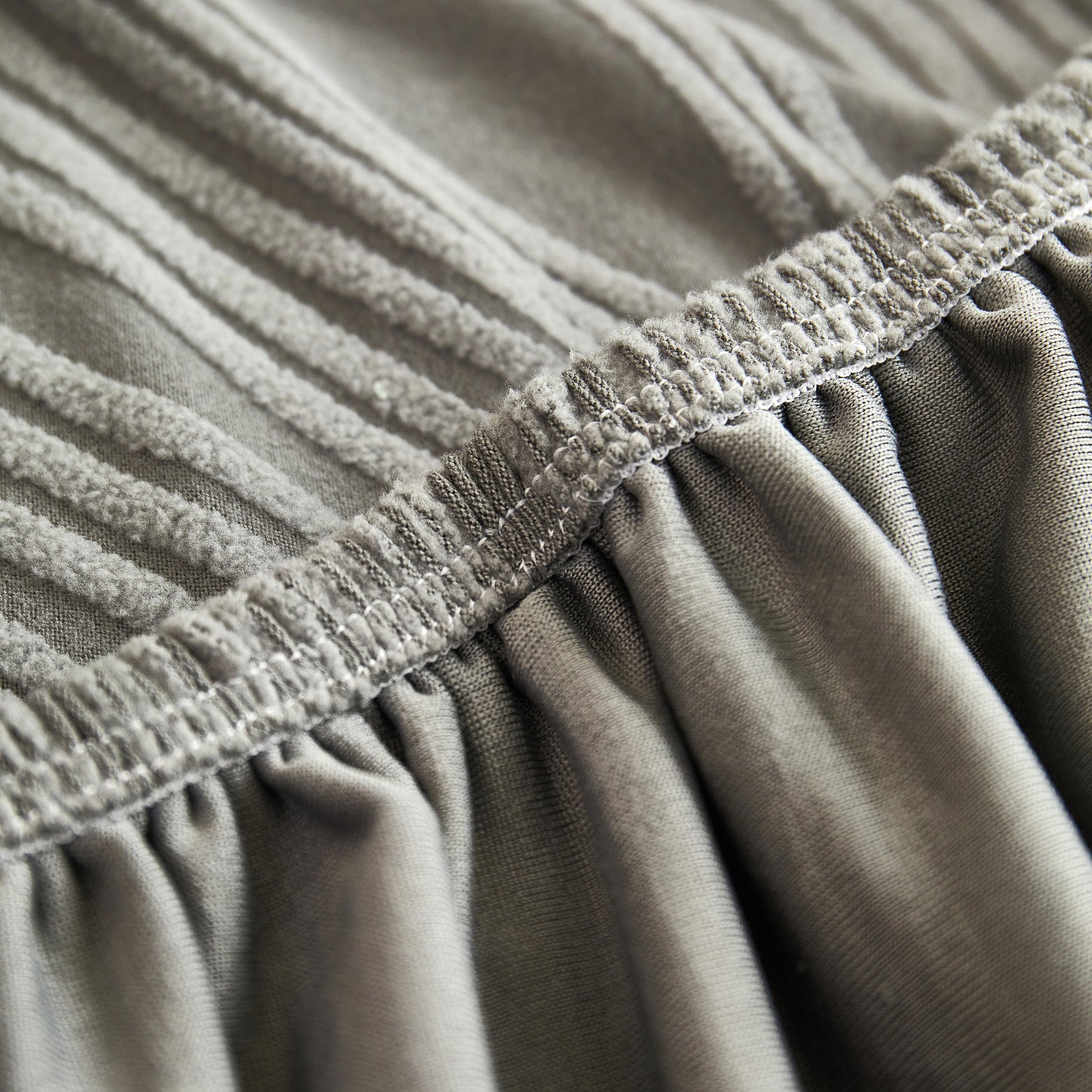 Close-up of a Textured Wave Stretch Sofa Couch Cover featuring soft washable spandex and durable wave pattern.